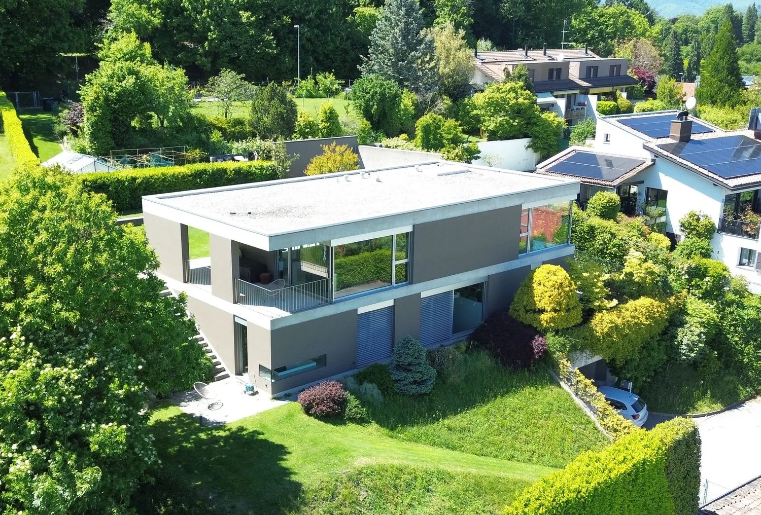 Elegant modern villa with garden and panoramic lake view in Carona.