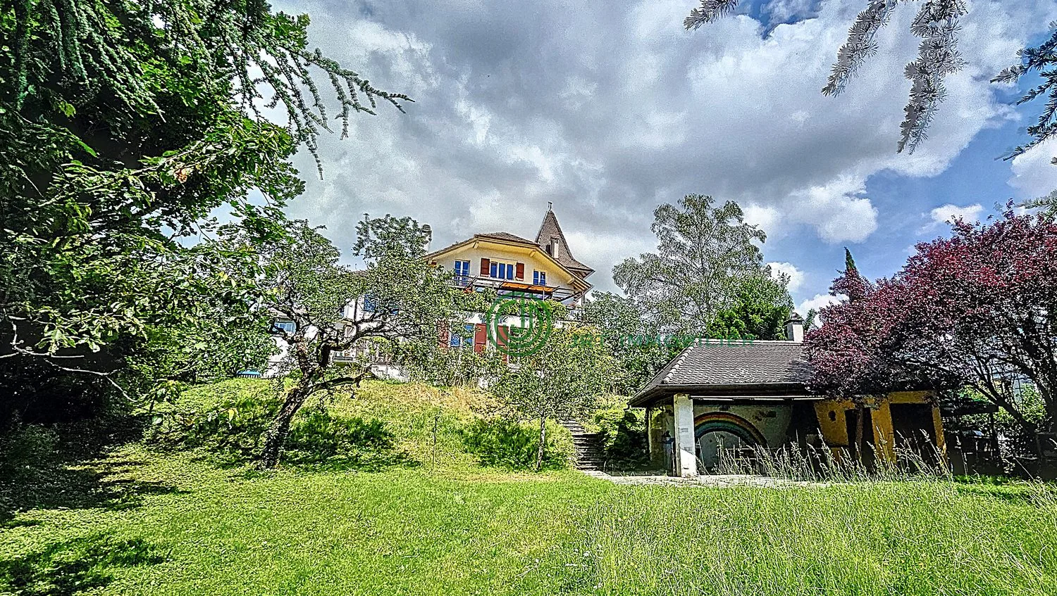 Large house with tower in a charming park Corcelles (NE)