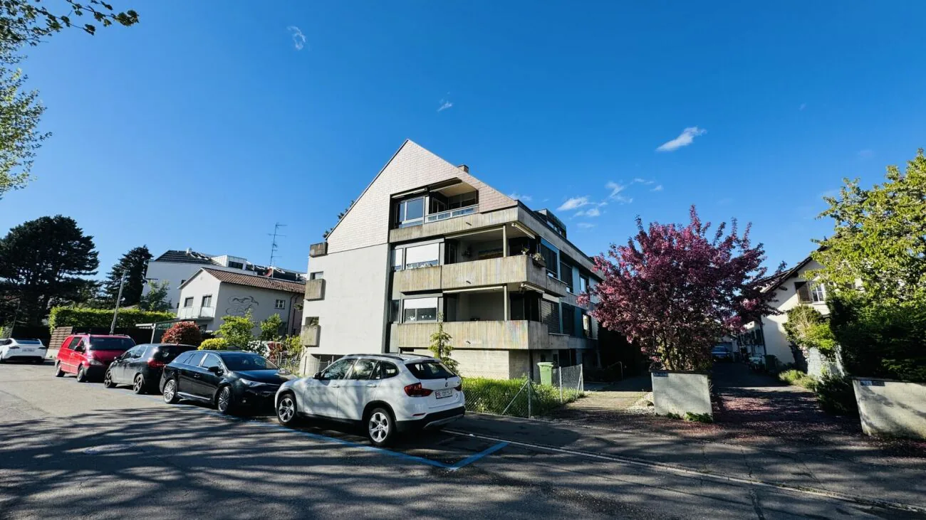 Completely renovated 2.5-room apartment with hobby room, balcony, attic, cellar, and underground parking space