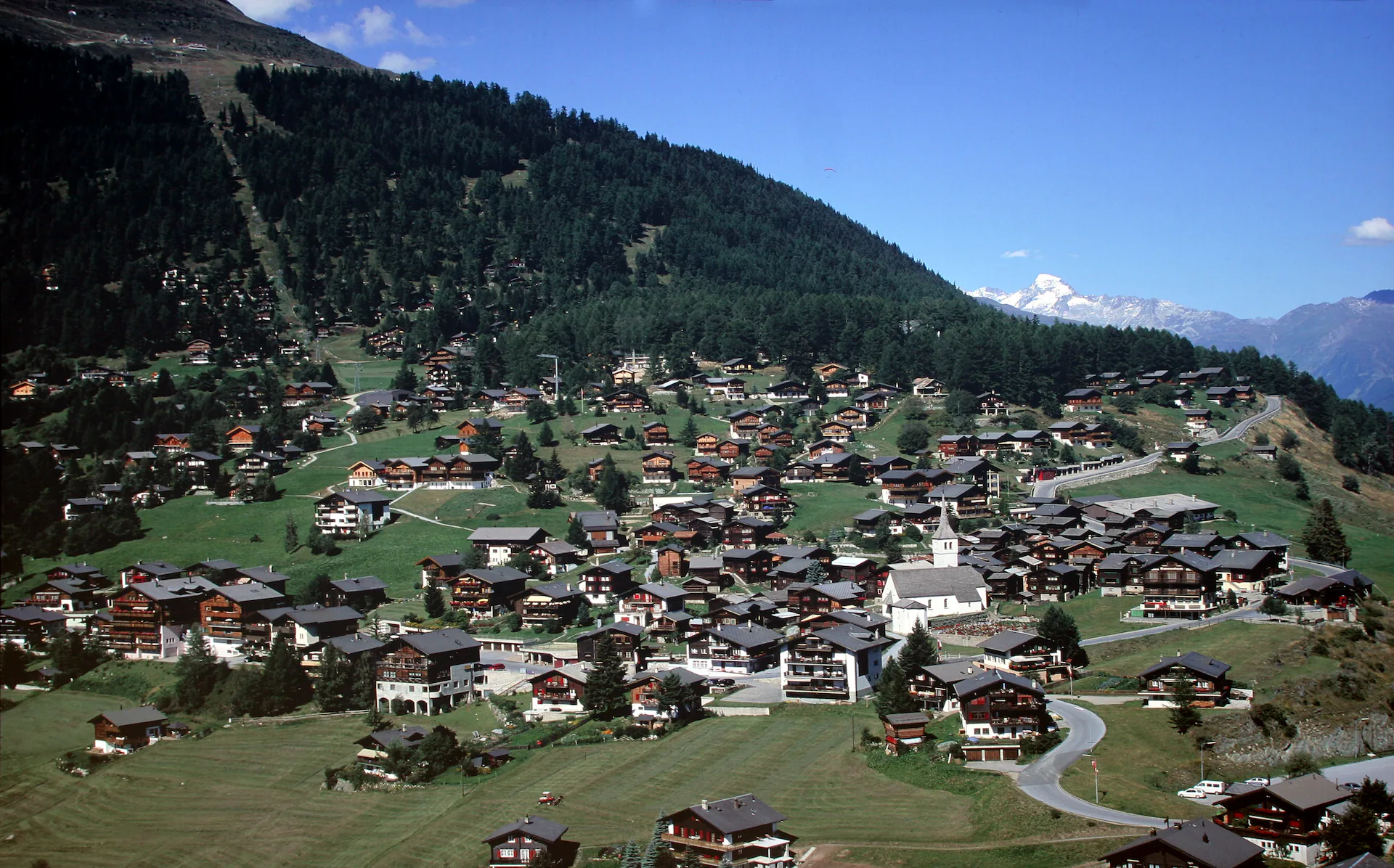 Bellwald in Valais (Switzerland). Railway station and church.
