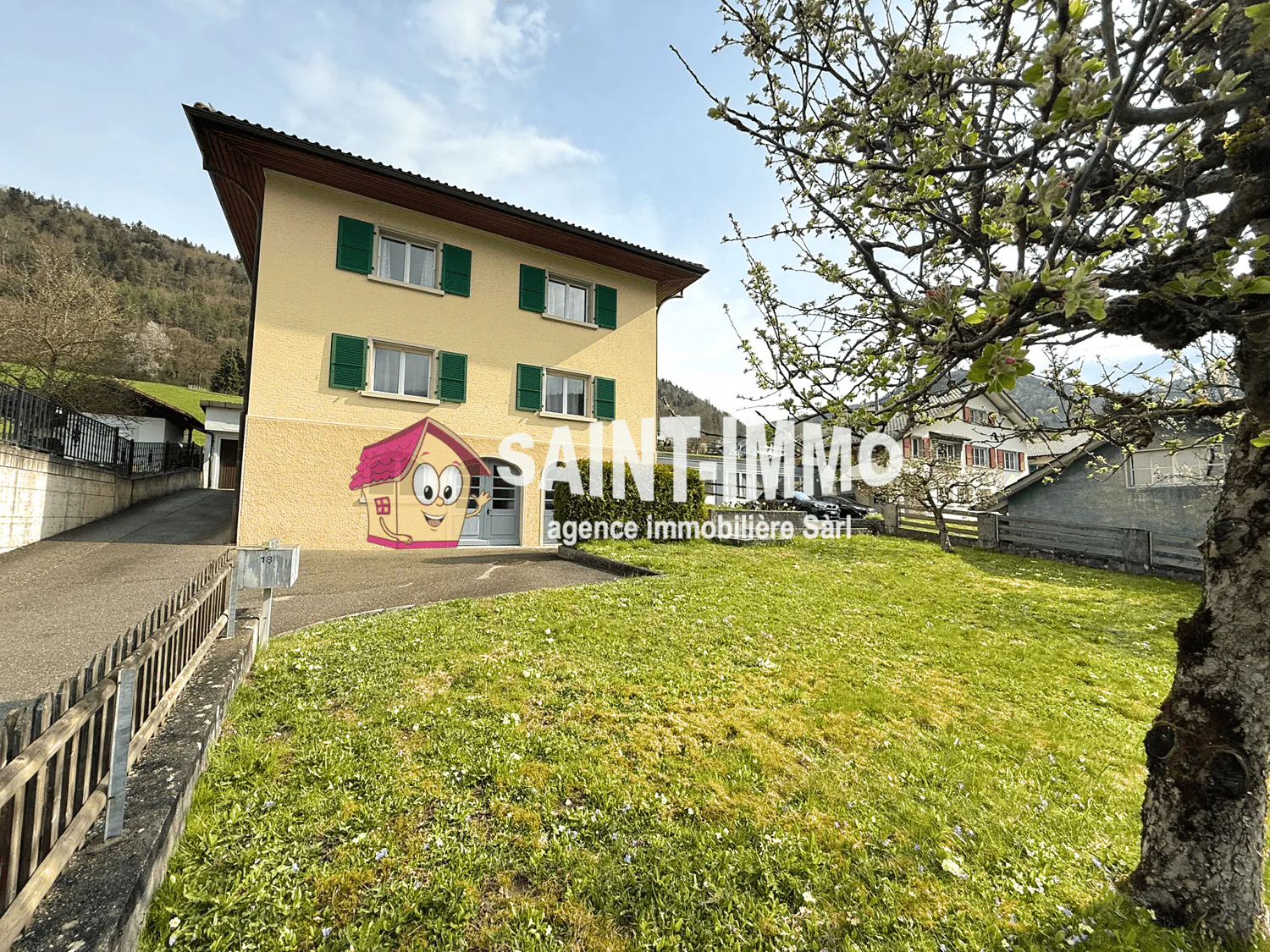 Two-family house with two apartments, garden, outbuilding, terrace, and garage